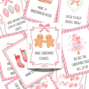 May include: A selection of pink and white Christmas cards with festive illustrations. The cards display images of gingerbread men, Christmas lights, and a Christmas tree. Text on the cards includes phrases such as "Bake Christmas Cookies" and "Go See the Christmas Tree All Lit Up."
