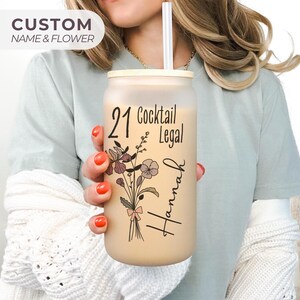 21st birthday glass with the number 21 and says cocktail legal colored birthflower personalized with name February birth flower shown Iris on frosted glass tumbler