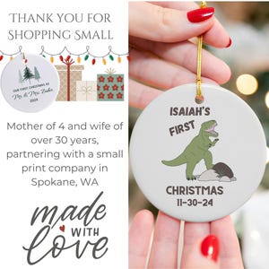 May include: White ceramic Christmas ornament with a green dinosaur illustration and the text "Isaiah's First Christmas 11-30-24".