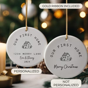 May include: Two white ceramic Christmas ornaments with black text and a house illustration. One ornament says "Our First Home" with a personalized address, names, and date. The other ornament says "Our First Home" with the text "Merry Christmas".