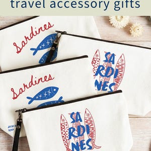 Sardines Mediterranean sailorcore personalized Zipper close canvas sardines makeup bag pencil pouch with bold blue and red sardine print and optional personalized name in script on cream coastal fabric. Sailorcore sardinecore and Mediterranean market girl aesthetic perfect for storing makeup pens and travel essentials and designed to coordinate with the large coastal sardines tote bag sold separately.