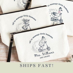 May include: White canvas zipper pouches with black trim and wrist straps. Each pouch features a whimsical illustration of an animal riding a scooter, with the text "off to manage little humans." One pouch is personalized with "Mrs. Williams 3rd Grade."