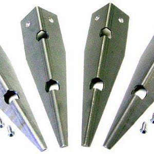May include: Four silver metal brackets with pointed ends and three holes each. The brackets are accompanied by eight small silver screws.
