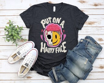スカルハッピーフェイスグラフィックTシャツ：面白い漫画Tシャツ
