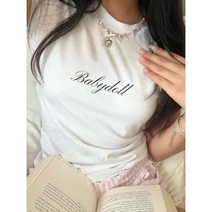 Babydoll coquette 90&#39;s Baby Tee, y2k Trending Cotton Baby Tee, Lana Del Ray Aesthetic, Cute Pink Girly Sustainable T-Shirt