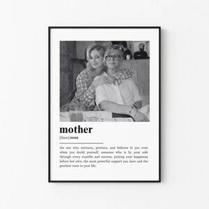 May include: Black and white framed print featuring a photograph of two people embracing. The word "mother" is printed below the image, along with a definition. The definition describes a mother's nurturing and supportive role.