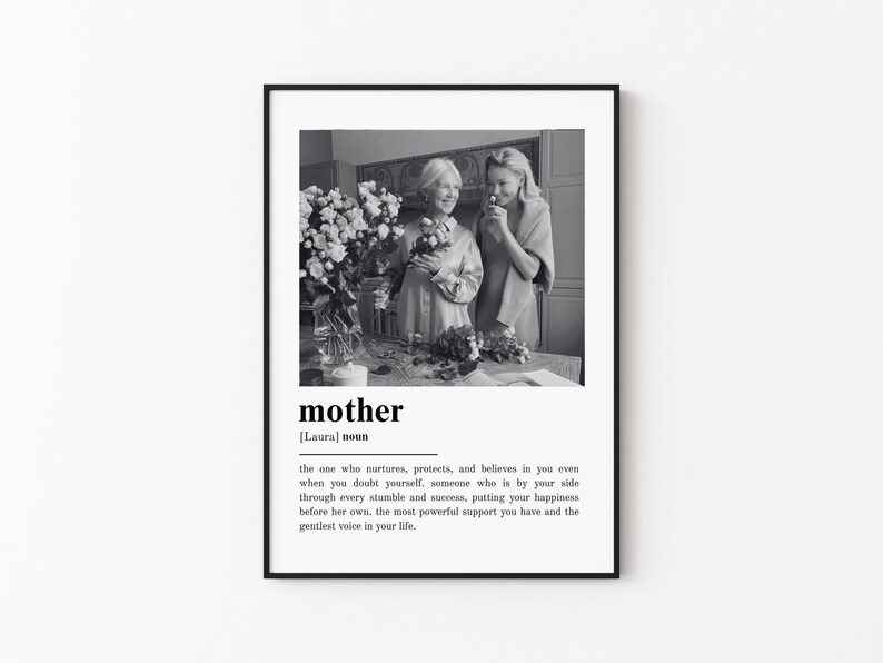 May include: Black and white framed print featuring a photograph of two women holding flowers. The word "mother" is displayed in a bold font, along with a definition. A thoughtful gift for Mother's Day or a special occasion.