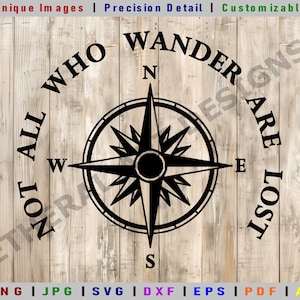 May include: Black and white compass with the text "Not all who wander are lost" around the compass. The compass is on a wood background.