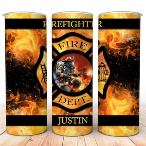 May include: A stainless steel tumbler with a firefighter theme. The design shows a firefighter, the words "FIRE DEPT." and the name "JUSTIN" against a backdrop of flames. Black bands are at the top and bottom of the tumbler.