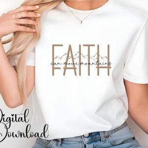 Könnte beinhalten: Weißes T-Shirt mit dem Text "FAITH can move mountains" in braunen Buchstaben mit einer Bergkette Grafik.