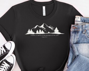May include: Black t-shirt with a white mountain range graphic and the text "Tremble, O earth, at the presence of the LORD Psalm 114:7".
