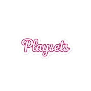 May include: A sticker with the word "Playsets" in a cursive, pink font with a white outline. The sticker is on a white background.