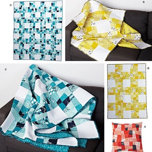 May include: A quilt pattern featuring a patchwork design with a mix of white, yellow, and blue fabrics. The pattern is called "Simplicity" and the number 1390 is printed on the page. The text "Elizabeth Hartman Quilts" is also printed on the page.
