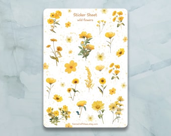 Peut inclure: Une feuille d'autocollants illustrant des fleurs sauvages jaunes. La feuille d'autocollants porte l'inscription "Sticker Sheet" et "wild flowers".