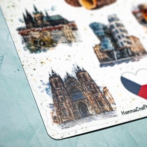 May include: A sheet of stickers featuring watercolor illustrations of Czech Republic landmarks. The stickers include images of Prague Castle, the Dancing House, and St. Vitus Cathedral. A heart-shaped sticker with the Czech flag is also included.