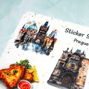 May include: A sticker sheet featuring watercolor illustrations of Prague landmarks and food. The sheet includes images of the Prague Astronomical Clock, a cityscape, and a plate of fried food with lemon and ketchup. The text "Sticker Sheet Prague" is also visible.