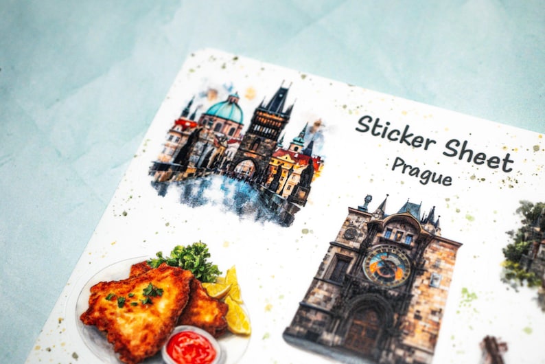 May include: A sticker sheet featuring watercolor illustrations of Prague landmarks and food. The sheet includes images of the Prague Astronomical Clock, a cityscape, and a plate of fried food with lemon and ketchup. The text "Sticker Sheet Prague" is also visible.