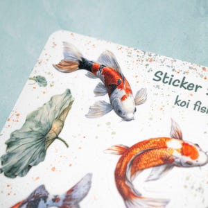 May include: Sticker sheet with illustrations of koi fish and lotus leaves. The sheet is white with a speckled background and the text "Sticker Sheet koi fish" at the top.