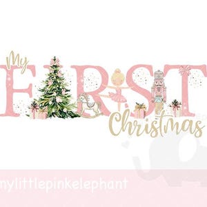 May include: A festive pink and gold graphic reading "My First Christmas." The design features a Christmas tree, a rocking horse, a ballerina, a nutcracker, and wrapped gifts. The text is in a decorative script font.