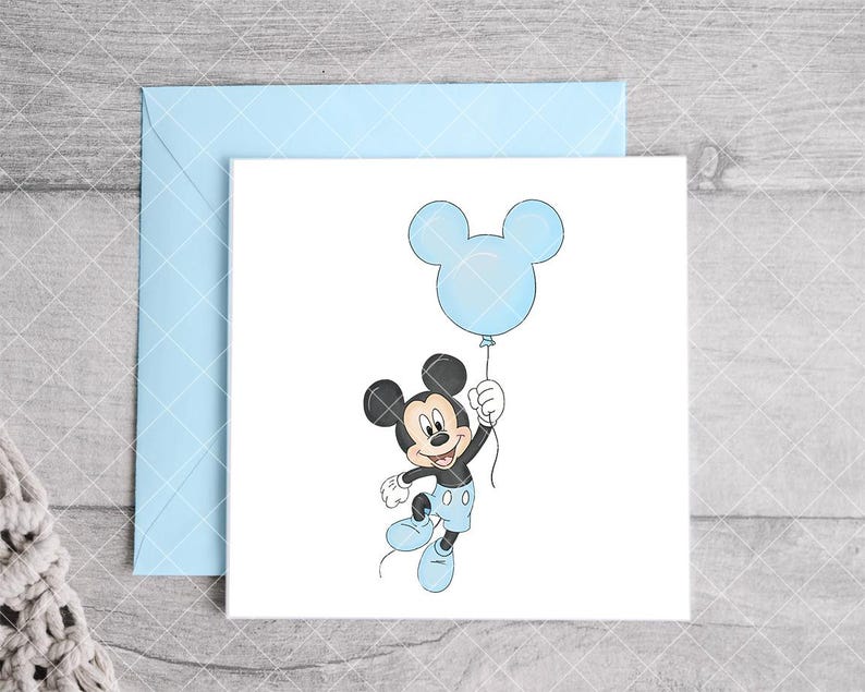 May include: A light blue envelope and a white card featuring a cartoon illustration of Mickey Mouse holding a blue balloon. Mickey Mouse is wearing blue shorts and shoes. The card is perfect for a birthday or baby shower.