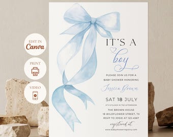 May include: Baby shower invitation with a watercolor blue bow and ribbons. The text reads "It's a boy" and includes details for the event, such as the date, time, location, and RSVP information. The design is elegant and suitable for a baby shower.