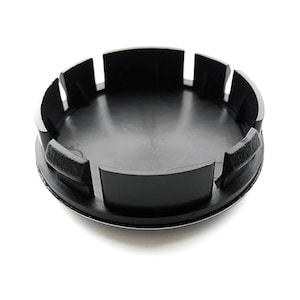 May include: Black plastic wheel center cap with a silver rim.