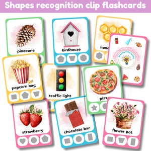 May include: A set of colorful flashcards featuring various objects, such as a pinecone, birdhouse, honeycomb, popcorn bag, traffic light, pizza, strawberry, chocolate bar, and flower pot. Each card includes the name of the object and three different shapes for matching.