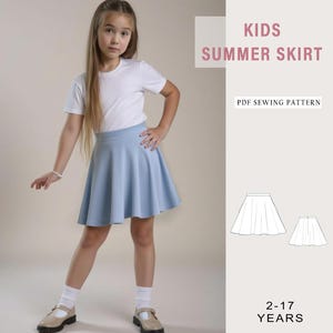 May include: A girl in a light blue summer skirt and a white t-shirt. The image includes the text "KIDS SUMMER SKIRT" and "PDF SEWING PATTERN". The skirt design is shown in a diagram, with the text "2-17 YEARS".