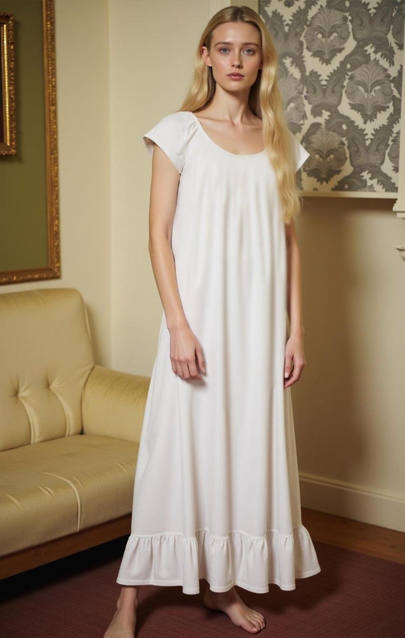 May include: A white cotton nightgown with a scoop neck and short sleeves. The gown has a ruffled hem and is floor-length.