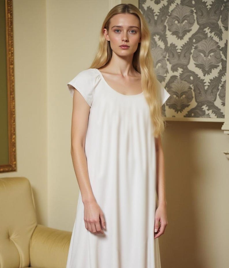 May include: A white cotton nightgown with a scoop neck and short sleeves.