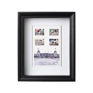 May include: A black framed print of a vintage photograph of a stadium with four black and white postage stamps of football players in action. The stamps are numbered 19, 25, 35, and 41. The print is signed "Greaves".