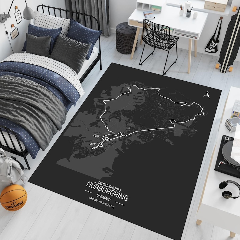 May include: Black and white map of the Nordschleife Nurburgring race track on a black rug. The text "(Nordschleife) Nurburgring, Germany, 20.832 km / 12.944 mi" is printed on the rug.