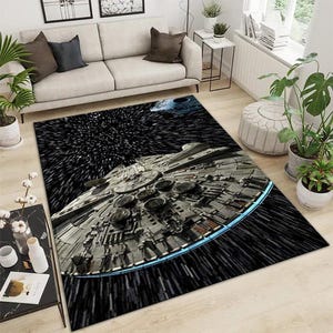 May include: A rectangular area rug featuring a detailed image of a spaceship in a starfield. The rug has a black background with white streaks, and the spaceship is gray with blue accents. The rug is placed in a living room.