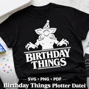 May include: Black t-shirt with a white graphic of a monster wearing a party hat and the words "BIRTHDAY THINGS". Includes a party hat, confetti, and a pen. Digital download available.
