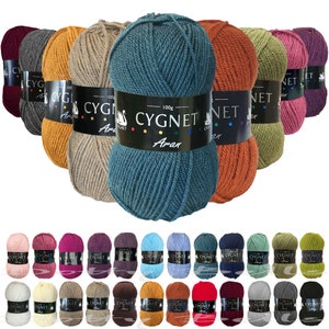 May include: Assortment of 24 balls of yarn in various colors, including red, orange, yellow, green, blue, purple, brown, and gray. Each ball is labeled "CYGNET Aran" and has a white swan logo.