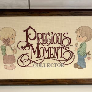 Framed Precious Moments Collector Cross Stitch Wall Hanging from the 1980s