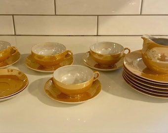 Vintage orange lyster kaffe- och tekoppar med tallrikar