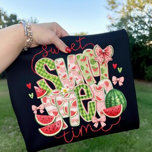 Striking watermelon sublimation art on a classic black pouch, showcasing high-contrast summer colors