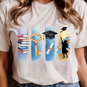 May include: White t-shirt with a blue, gold, and black design featuring a stack of books, a key, a graduation cap, a diploma, and a silhouette of a person throwing a graduation cap in the air.