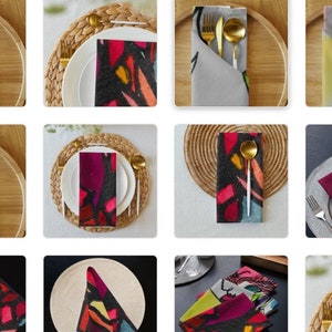 Peut inclure: Plusieurs serviettes avec des motifs abstraits colorés et des couverts dorés. Les serviettes présentent des motifs vibrants dans des tons de rose, violet, jaune et orange. Les couverts comprennent une fourchette, un couteau et une cuillère.