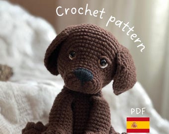 May include: Crochet pattern PDF for a brown crocheted dog toy. The pattern is available in both English and Spanish.