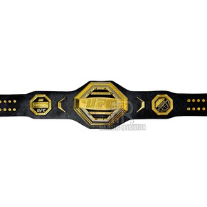 May include: A black leather UFC championship belt with gold accents. The belt features a large octagonal center plate with the UFC logo and the words "Ultimate Fighting Championship".