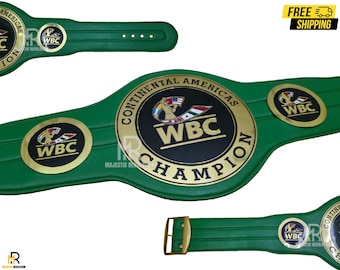 Könnte beinhalten: Grüner Box-Meisterschaftsgürtel mit goldenen Akzenten. Der Gürtel zeigt das WBC-Logo und die Worte "Continental Americas Champion". Er hat eine goldene Schnalle und besteht aus grünem Material.