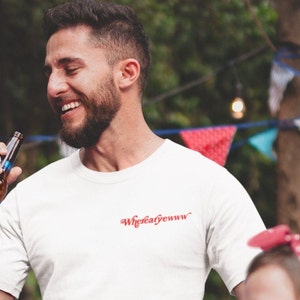May include: A white t-shirt with the text "Where'd ya' go" in red cursive lettering.