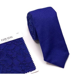 cobalt blue bow tie and suspenders