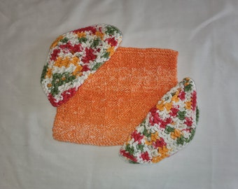 Set of three orange/multicolored knitted and crocheted cotton dishcloths