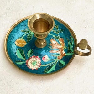 Enameled brass candle holder with floral decoration, cellar rat