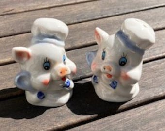 Salero y pimentero de cerdo cocinero de porcelana blanca