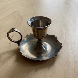 Old small brass cellar rat hand candle holder