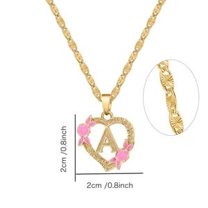 May include: Gold chain necklace with a heart-shaped pendant featuring the letter 'A' with pink enamel flowers. The pendant measures 2 cm in diameter.